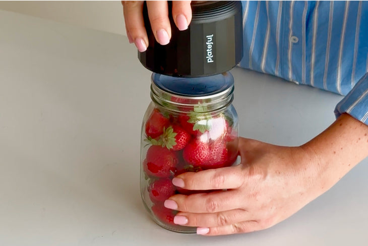 Vacuum sealer positioned on a filled mason jar