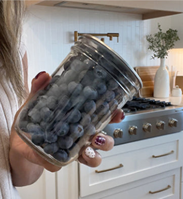 Customer holding a vacuum-sealed mason jar